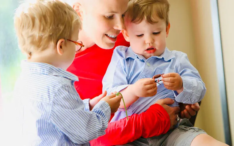 Erica red shirt two boys 800x800