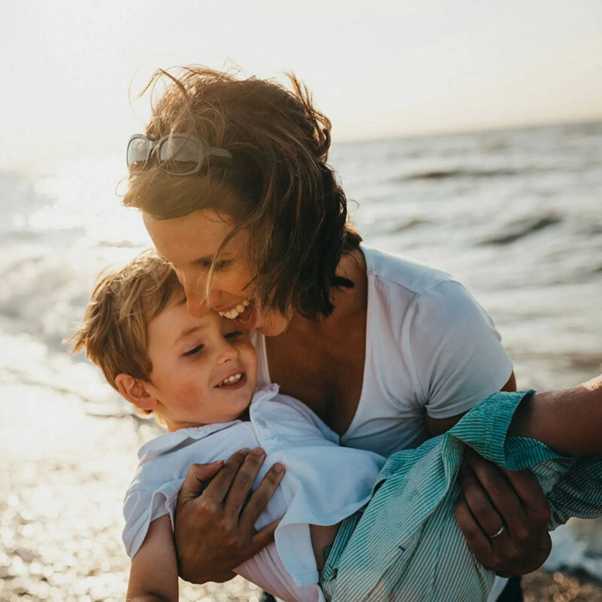 Mom holding kid 800x800